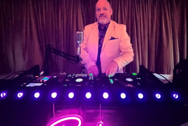 dj lloyd bracken behing the dj booth in action at a wedding