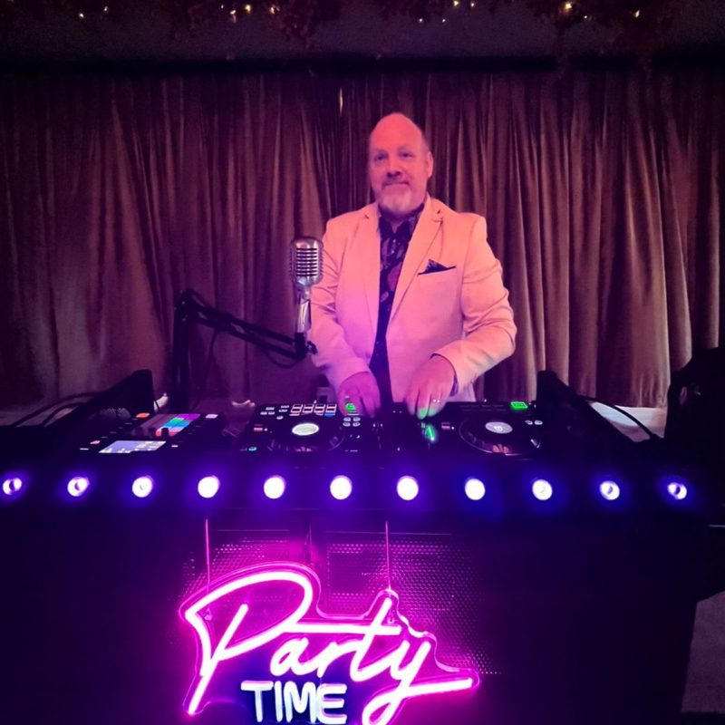dj lloyd bracken behing the dj booth in action at a wedding